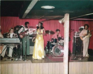 Before she left for Atlanta, Dayton native Dottie Peoples worked in clubs around the Gem City as Lil Dot. Not sure where this gig is at, with that wooden pole up front, but that looks like Mike Manley(aka: Mikael Man) on guitar on the right. Who are the other guys pictured here?
